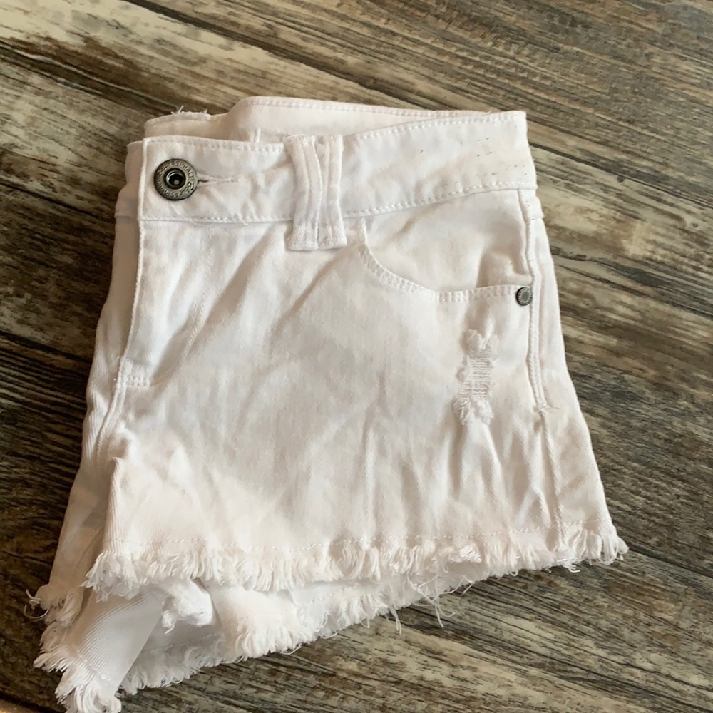 White distressed jean shorts